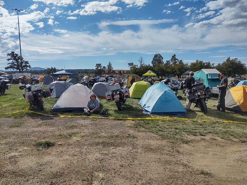 many tents and motorcycles
        next to each other